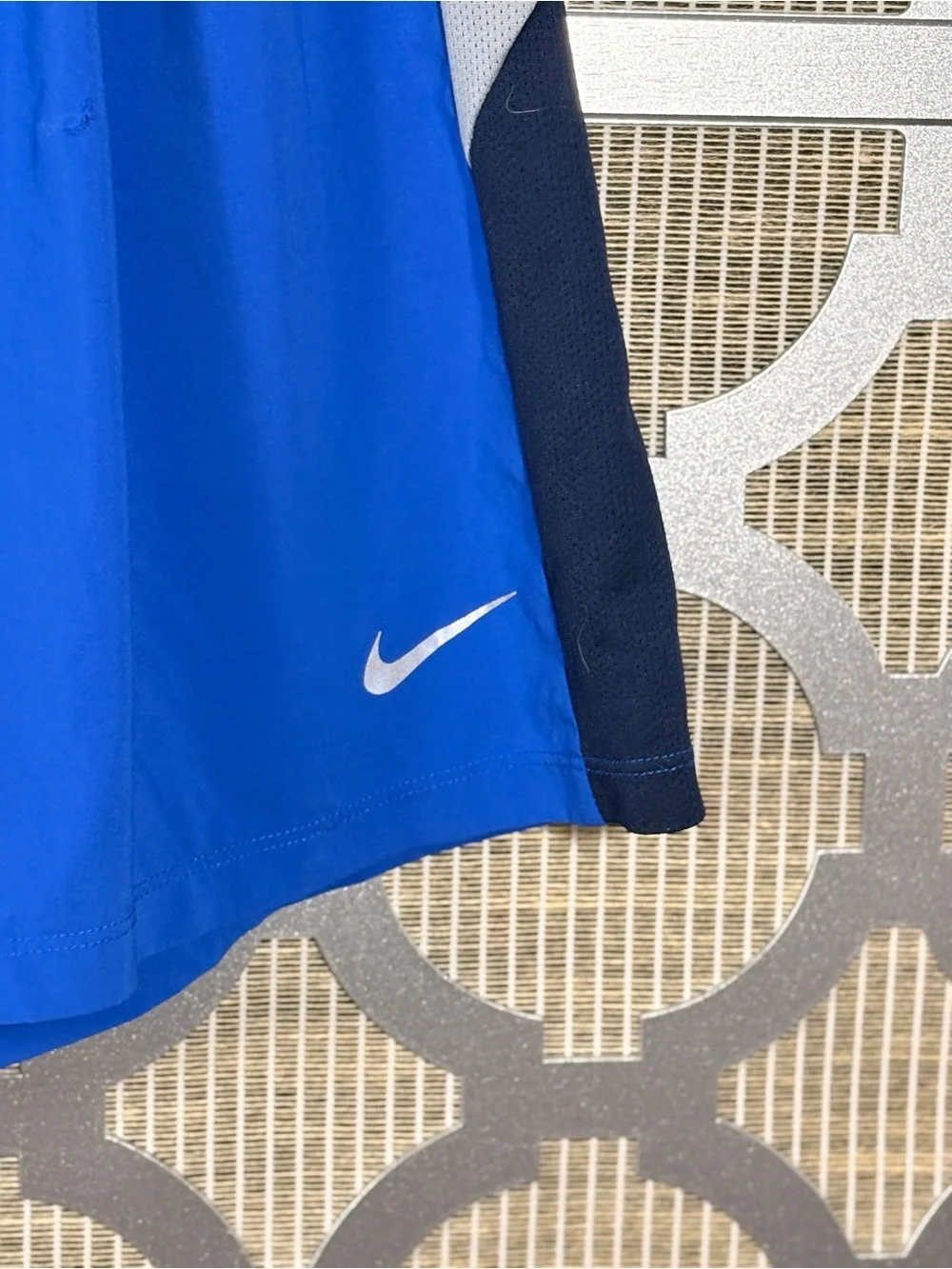 Nike Men’s Royal Blue Athletic Shorts with Gray & Navy Panels and has a snag
